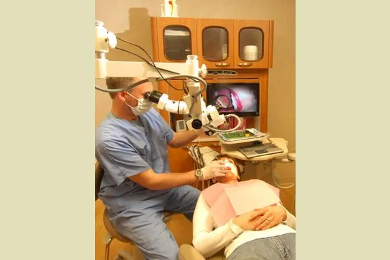 Dr. Harris performing an exam in operatory room