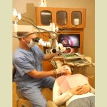 Dr. Harris performing an exam in operatory room