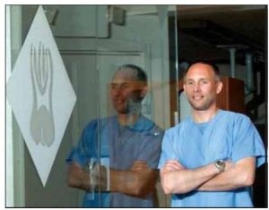 Dr. David J. Harris standing at the entryway to Advanced Care Endodontics
